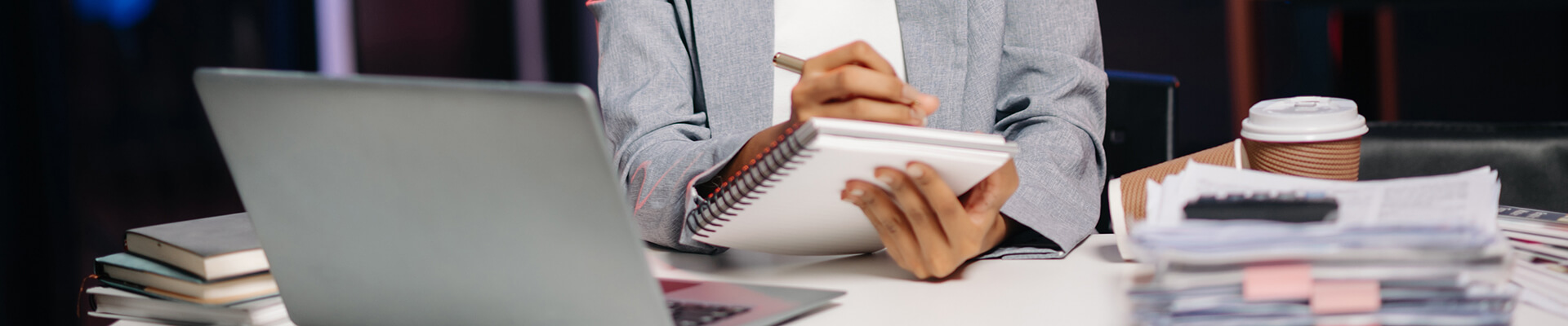 man writring in notebook